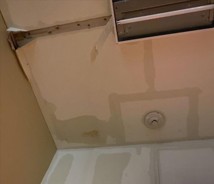 A ceiling with water damage
