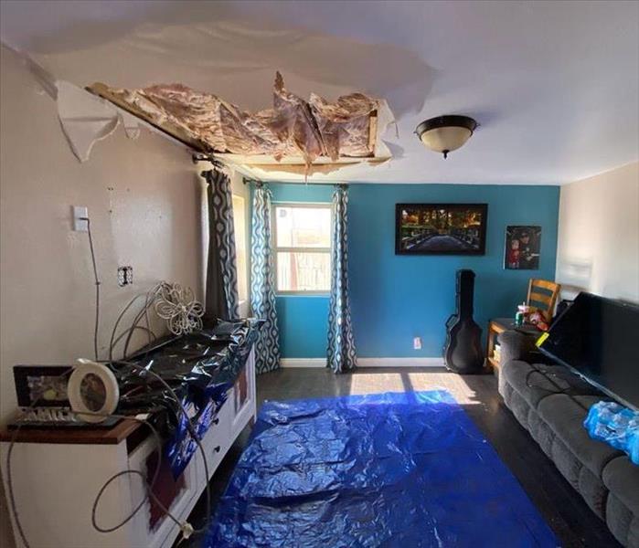 A room where the ceiling has damage